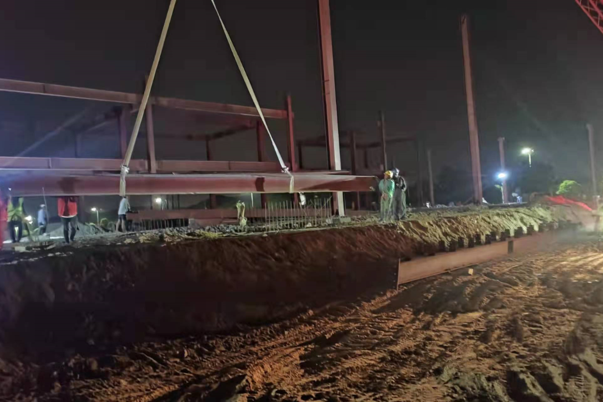 emerald-ecommerce-center-steel-beam-lift-night